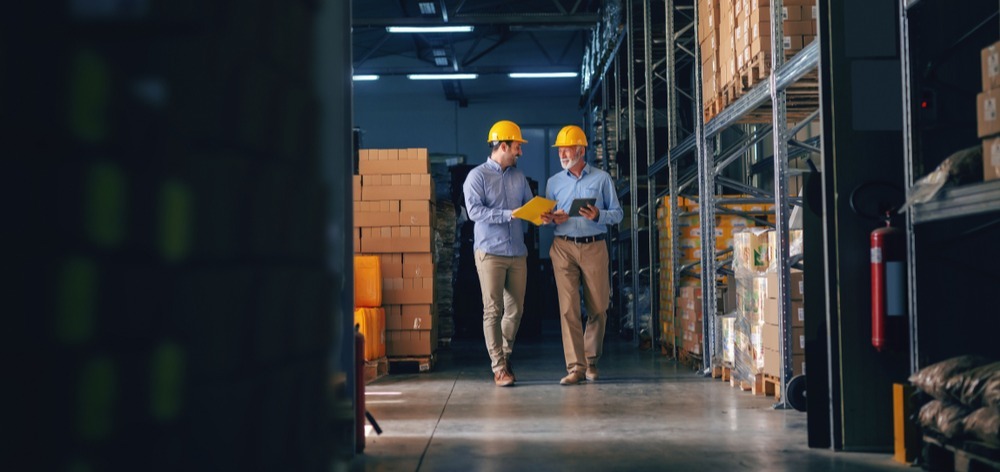 Two manufacturers walking and talking-1